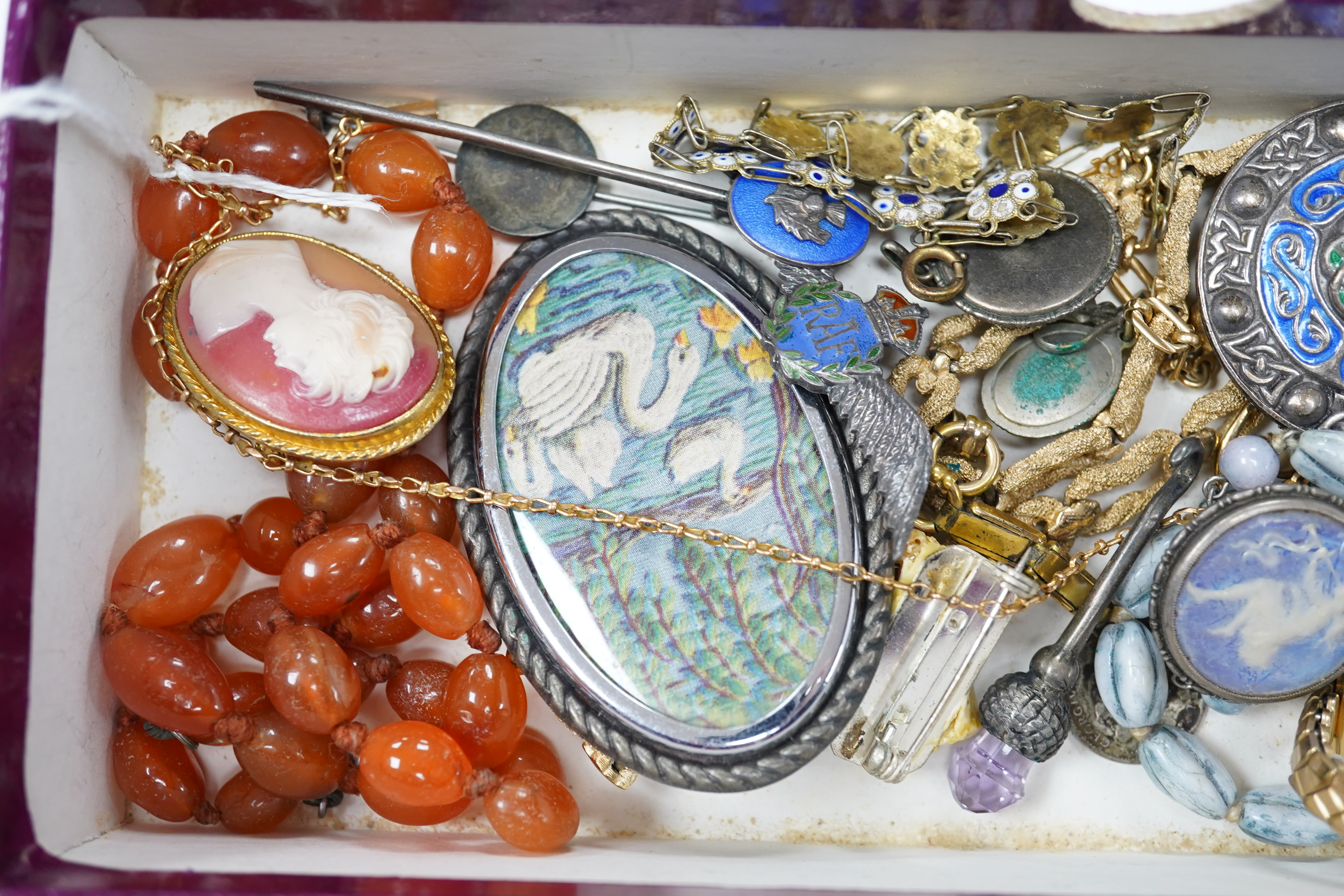 A mixed group of jewellery, including a yellow metal chain stamped 15c, 4.5 grams, a 9ct 'H' charm, a George VI silver and enamel Celtic style brooch, by A H Darby & Son, a sterling book mark, an agate bead necklace and